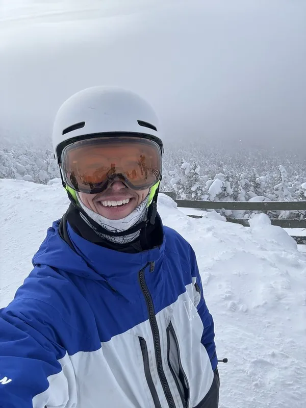 Justin Whalen, founder of ClearPath, smiling on a snowy ski slope